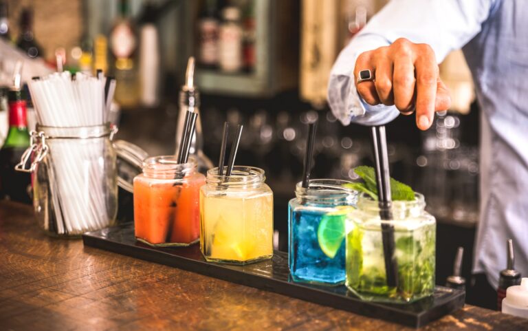 bartender-hand-at-multicolored-fashion-drinks.jpg